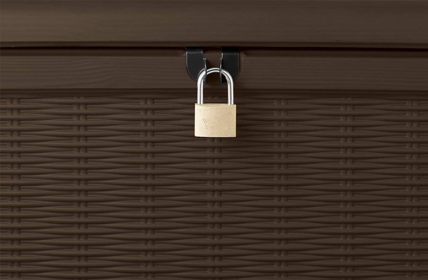 Close-up of brass padlock secured to the storage box lock loop on rattan-effect front