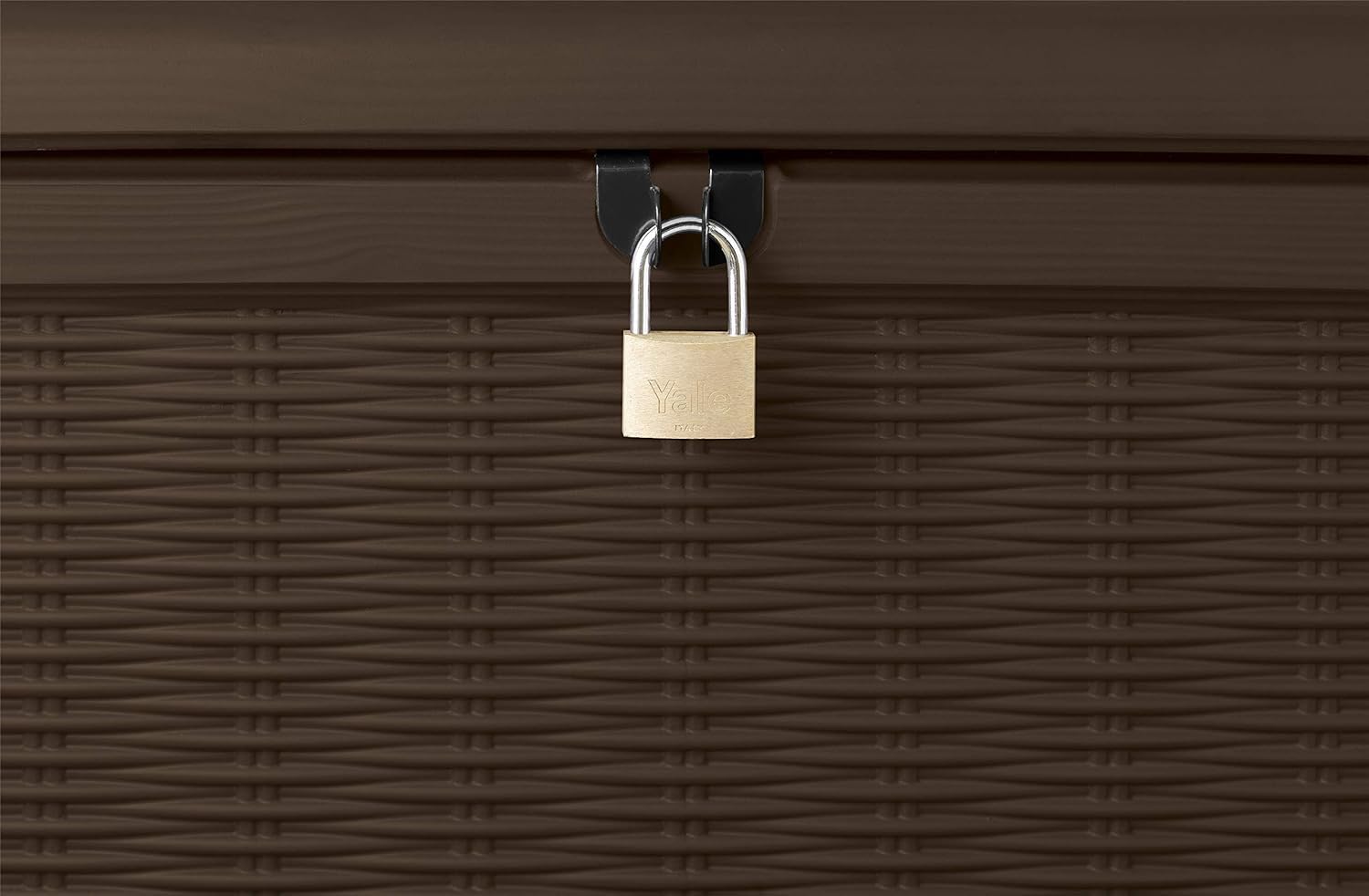 Close-up of brass padlock secured to the storage box lock loop on rattan-effect front