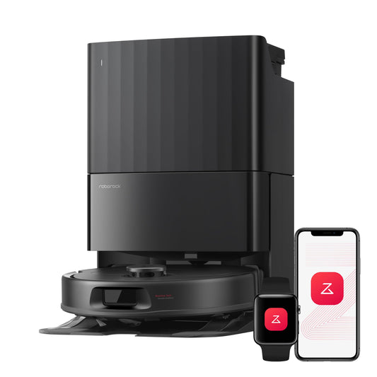 Close-up of a tall black self-cleaning dock atop the robot vacuum with smartphone and smartwatch showing the companion app
