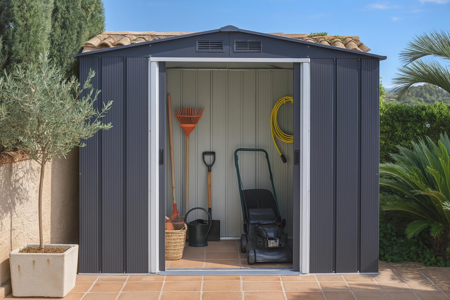 Anthracite shed in a garden with sliding doors open showing a lawn mower, rake, shovel and coiled yellow hose