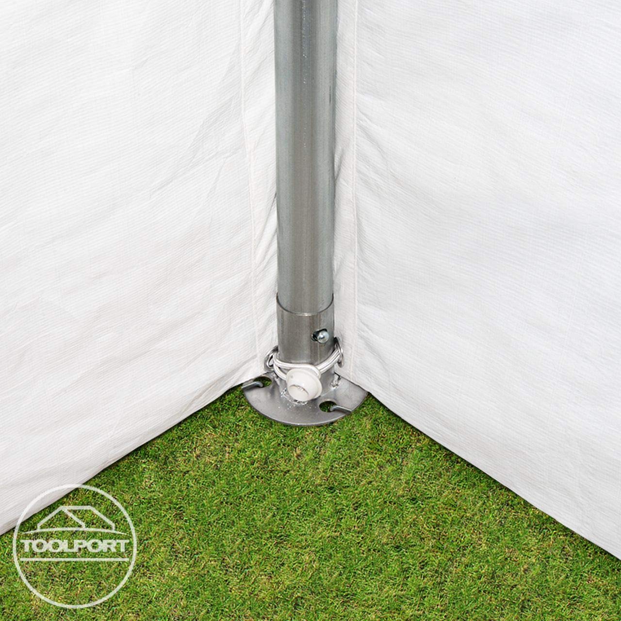 Corner base plate with vertical pole anchored to grass and secured with a grommeted cord