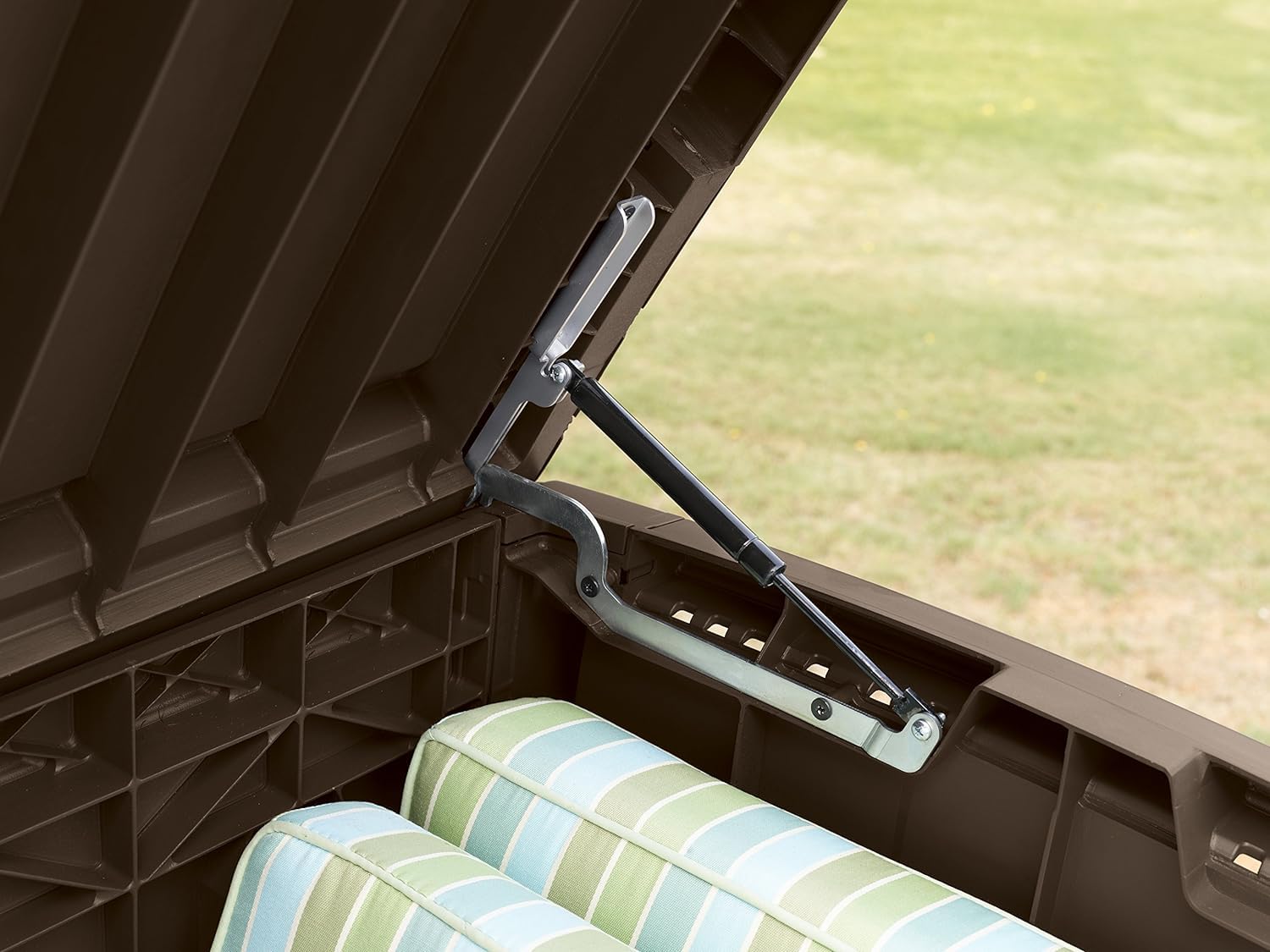 Side corner view of storage box showing rattan-effect panel and supporting leg