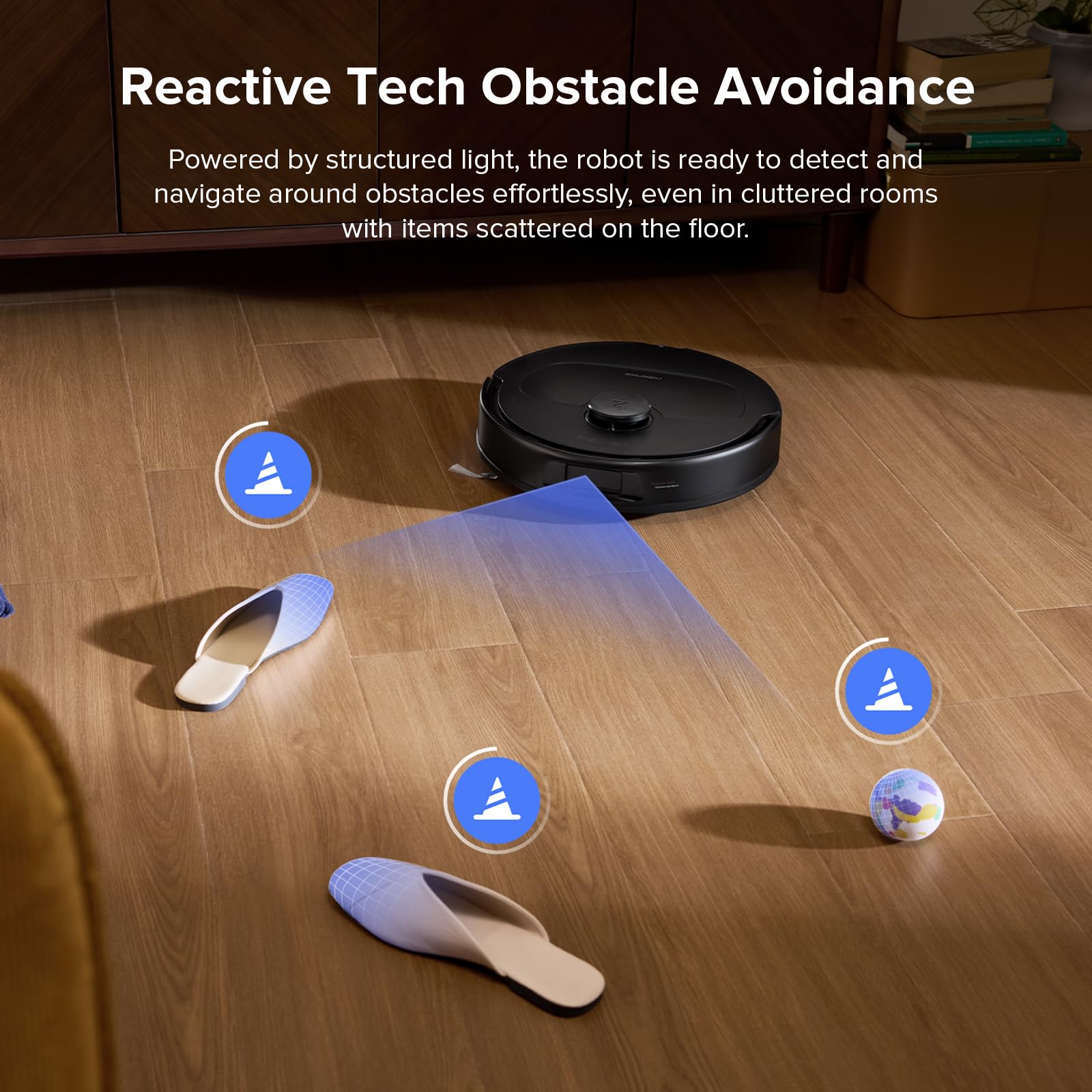 Robot vacuum navigating around slippers and a small ball on hardwood, with a blue sensor beam visualizing structured-light…