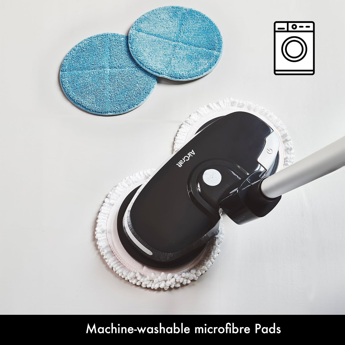 Top view of PowerGlide with two spare blue machine‑washable microfiber pads placed nearby