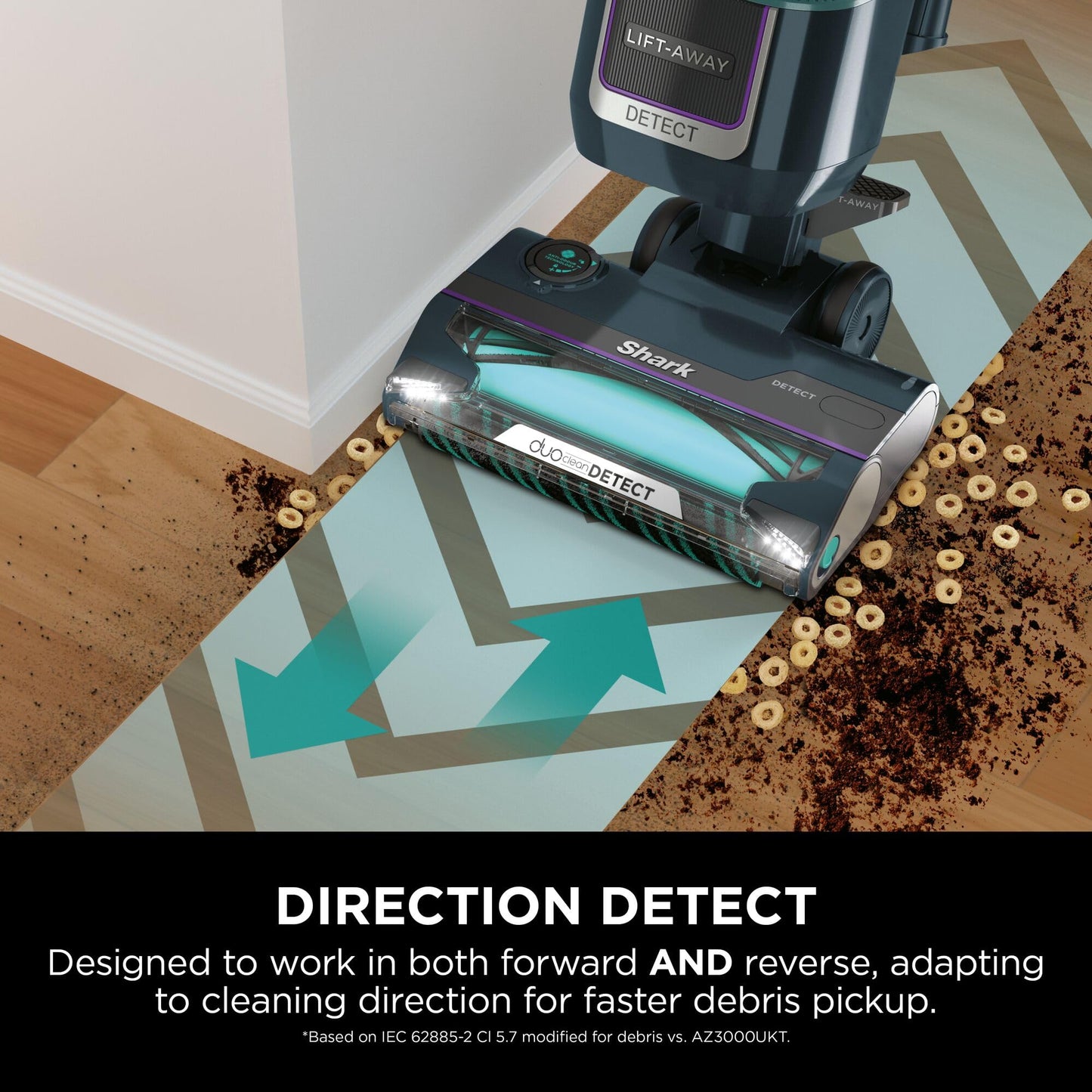 Vacuum head cleaning spilled cereal and dirt at a room edge, showing LED lights and the brushroll