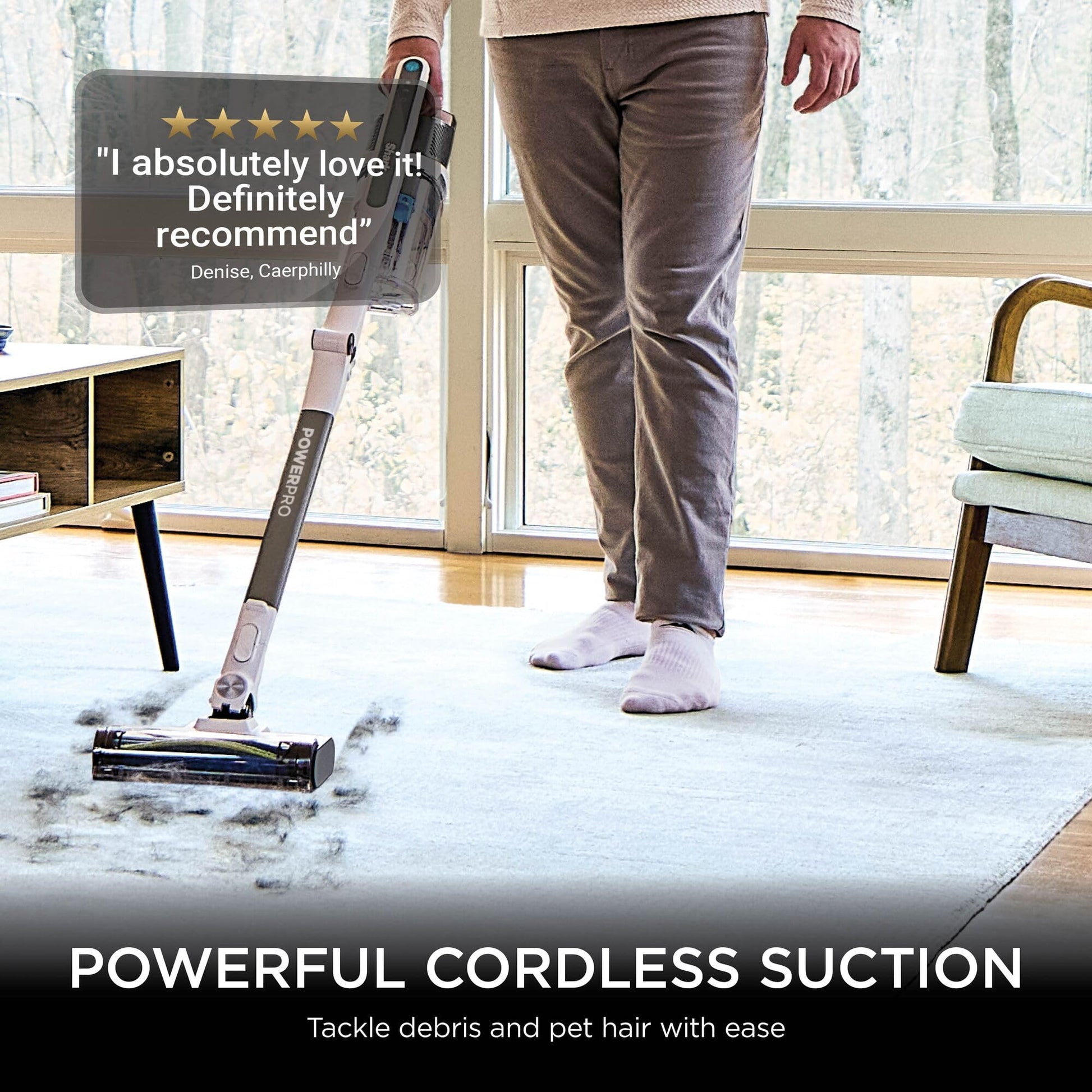 Person using the Shark stick on a rug with a five‑star customer review overlay saying “I absolutely love it! Definitely re…
