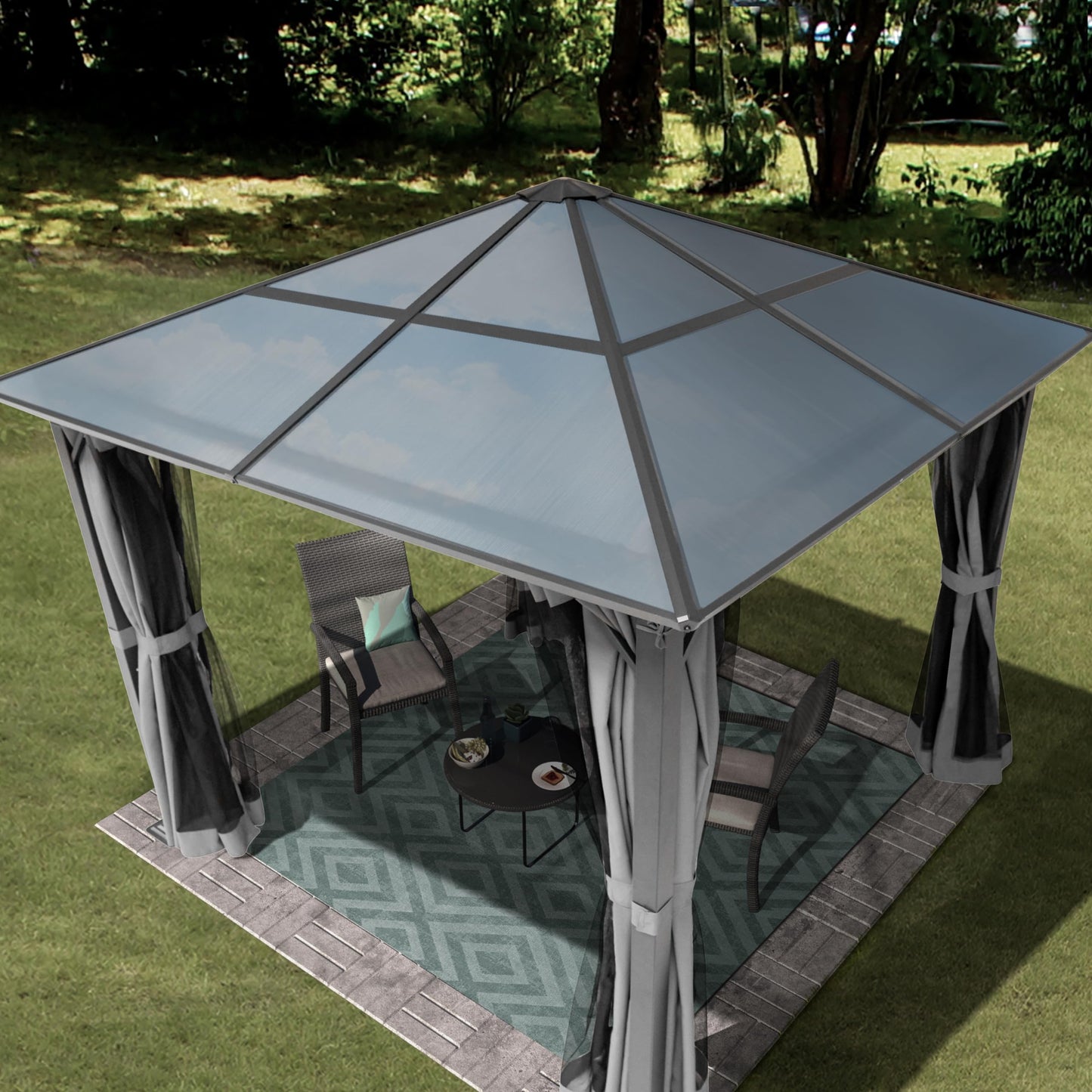 Front view of the gazebo with mosquito netting and grey curtains; rattan chairs and small table visible inside.