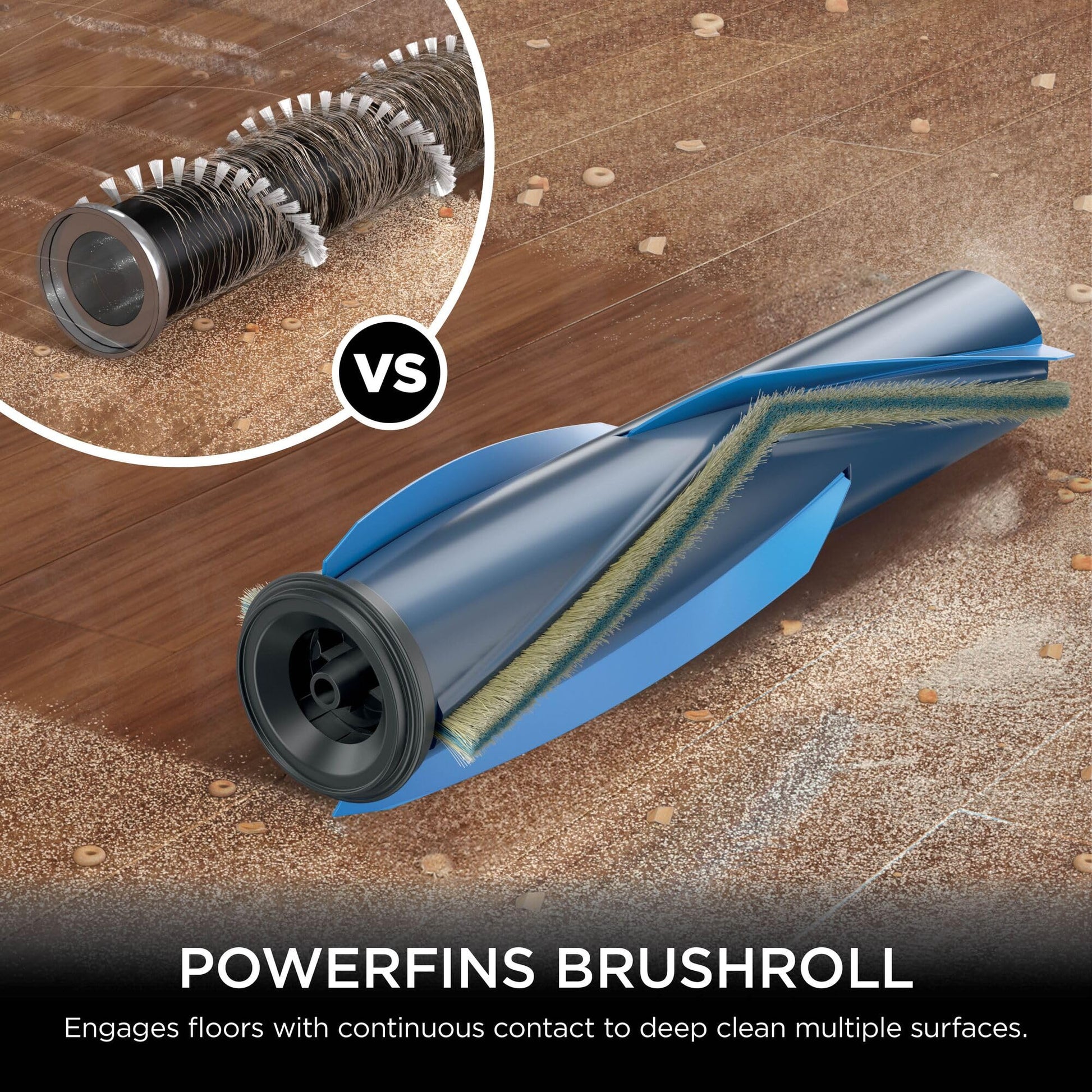 Close-up of the PowerFins brushroll moving debris on a rug, illustrating the brushhead collecting dirt and particles.