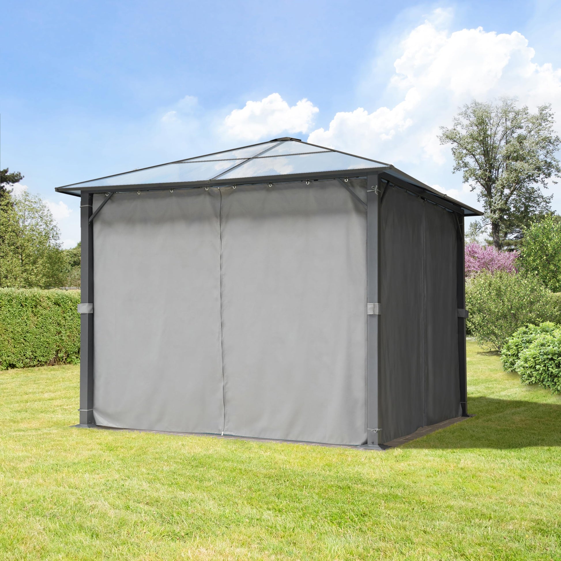 Side view of gazebo roof peak and eave with translucent panels against a blue sky and trees.