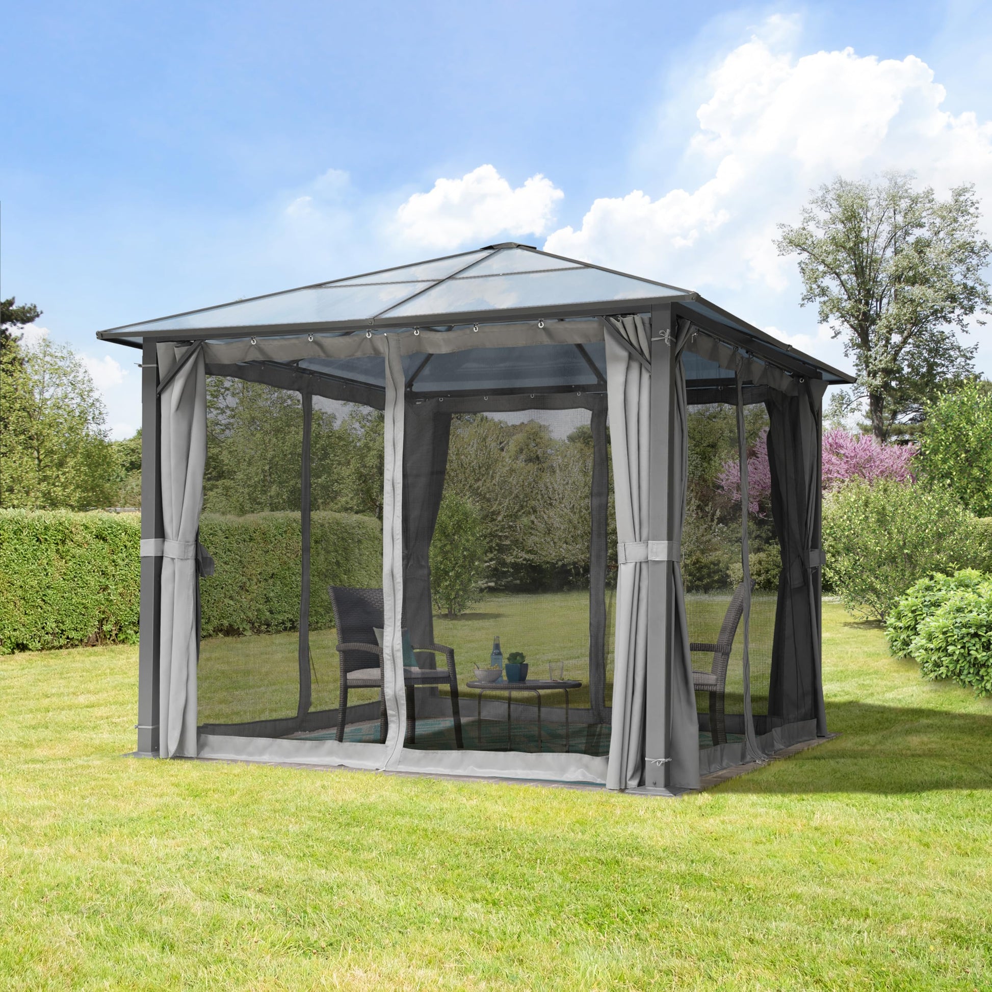 Rear corner of the gazebo showing a closed grey side curtain, square steel post and anchored base on the lawn.