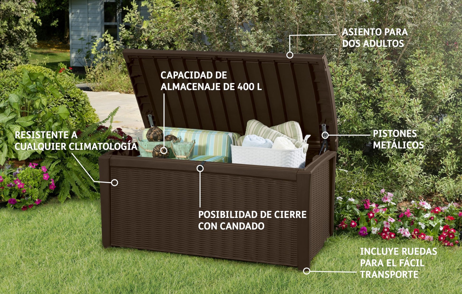 Open brown storage box in garden filled with cushions and a white basket, Spanish feature text overlay visible